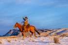 USA- Wyoming. Hideout Horse Ranch- wrangler and horse in snow. Art Print